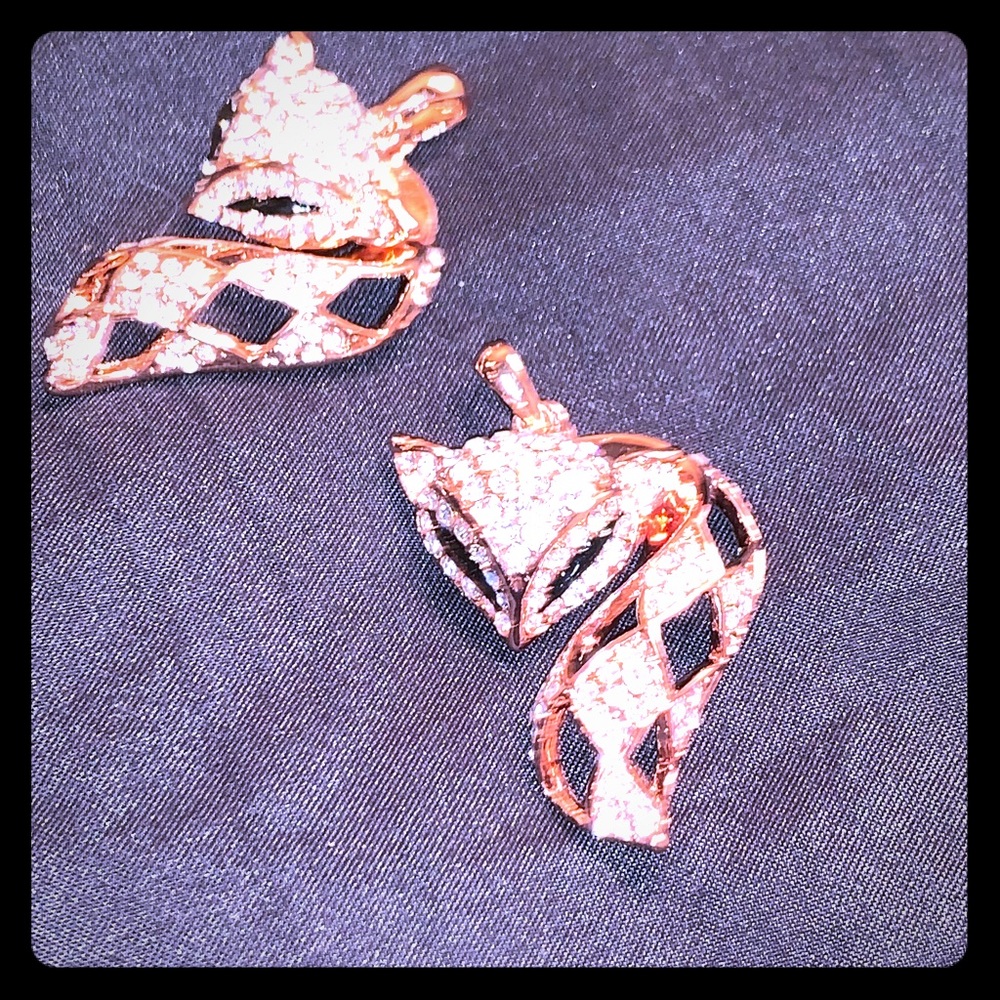 Two rose gold plated and crystal fox pendants
